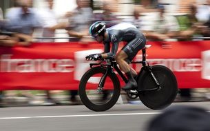 cyclist on racing bike on road