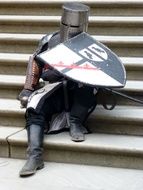 knight sitting on the stairs