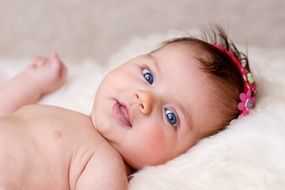 newborn girl with flowers in her hair