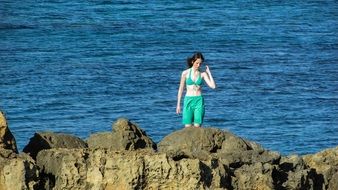 Girl on a rocky beach
