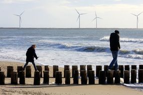 children go on the wooden breakwaters in Zealand