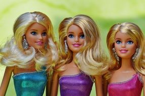 three Barbie dolls with white hair