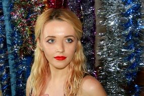 portrait of blonde in christmas tinsel