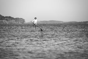 Stand up on a paddle in ocean