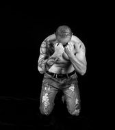 man with a tattoo on his knees