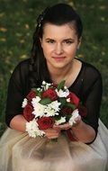 girl in evening dress with a bouquet