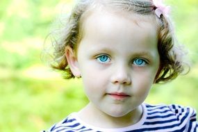 portrait of a little girl with blue eyes
