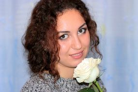 romantic portrait of a girl with a white rose