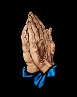 hands in prayer on a black background