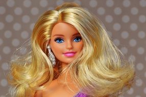 Barbie doll on a brown background