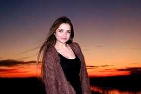 young caucasian Girl at Sunset Sky
