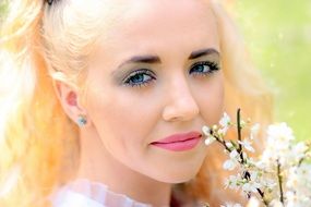 portrait of a blonde in spring garden