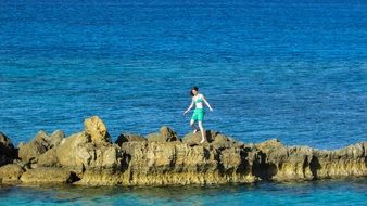 young woman on the rocks
