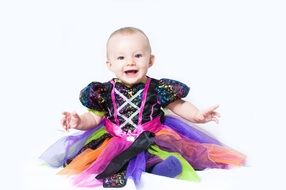 little girl in a colorful dress for Halloween