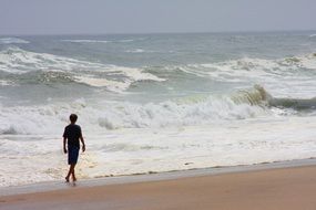 Boy Walking on the Beach