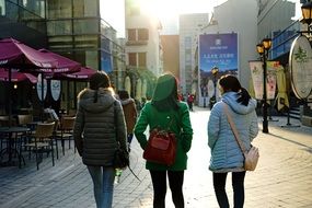 three girls on the street of shanghai