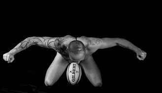strong man in tattoos