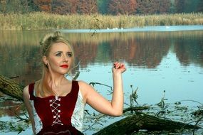 portrait of girl posing by the lake