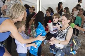 female Volunteers Helping to Children