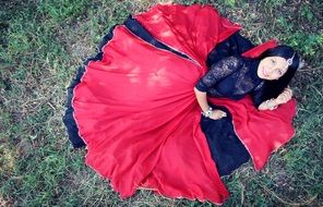 indian lady in black and red sari