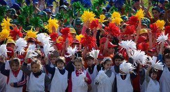 children with colorful pompons on holiday