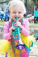 child with a pipe at the carnival
