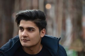 young man on background of trees
