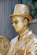 golden living statue in profile