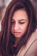 portrait of a pensive girl with dark hair