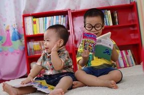 children play with books