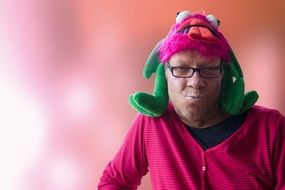 man in glasses and carnival hat