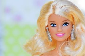 Barbie doll with blond hair and large earrings