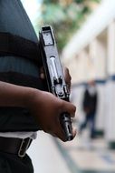 armed security guard in profile closeup