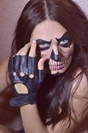 young woman with skull makeup