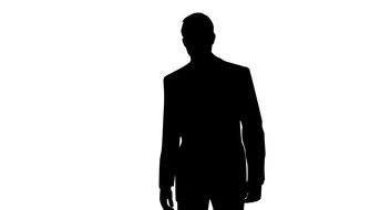 silhouette of a man in a jacket