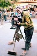 old man shoots with a vintage camera, india, japur