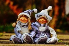Boy and Girl, Funny toys in winter clothes