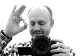 photographer in focus in black and white image