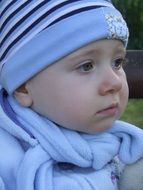 little boy in blue clothes