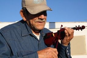 street musician with a little violin