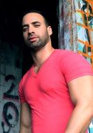 muscular man in pink t-shirt