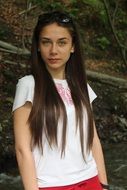 long haired young girl in white t-shirt outdoor