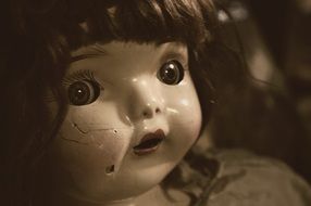 Vintage doll with a damaged face