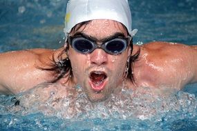 swimmer in a swimming cap in the pool