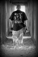 man with a gun black and white pho
