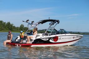 happy family with kids on anchored Boat