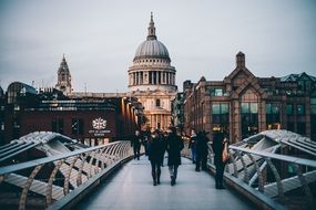 People on bridge in beautiful evening cityscape with landmarks, uk, London