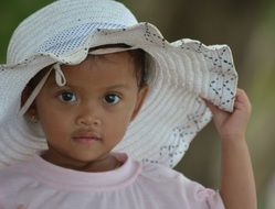 child of Cambodia in a hat