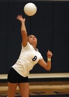 athletic girl playing volleyball