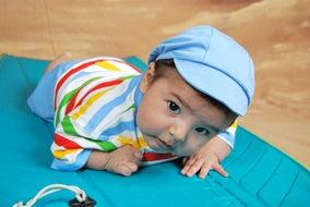 little baby crawling on the blanket